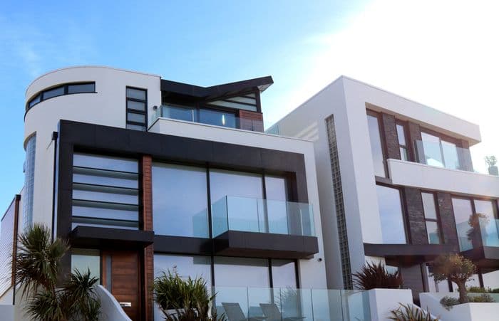 Modern commercial building with glass balconies and facades